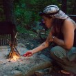 Sarah lighting the campfire